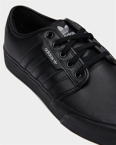 adidas black leather sneakers.